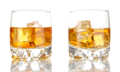 Brandy glasses with ice isolated on white