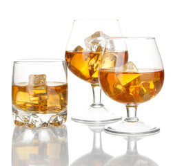 Brandy glasses with ice isolated on white