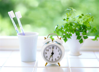 Toothbrush and alarm clock