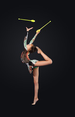 Fototapeta na wymiar Young woman in gymnast suit posing