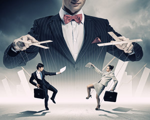 Businessman puppeteer