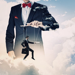 Businessman puppeteer