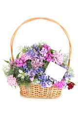 Beautiful bouquet in basket isolated on white