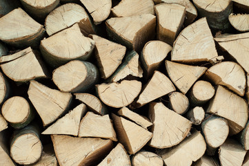 Pile of chopped firewood abstract pattern, background texture