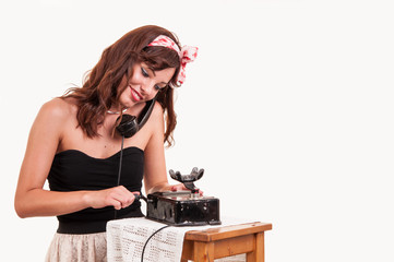 Beautiful and fashion young woman with a retro look smiling and