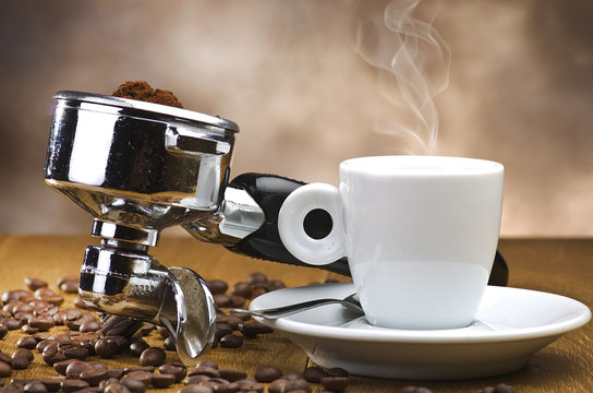 An espresso machine group head with fresh ground coffee