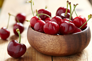 fresh cherries on wooden table