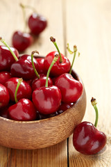fresh cherries on wooden table