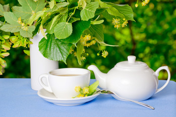 Breakfast outdoors with linden tea