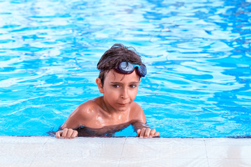 Portrait of the boy in the pool