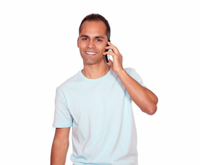 Smiling latin adult man speaking on cellphone
