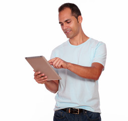 Latin adult man using his tablet pc