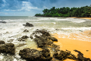 rocky beach with dark clouds