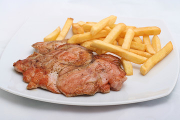 juicy steak with french fries on a plate