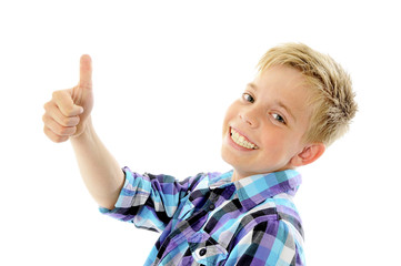 Happy boy showing thumbs up gesture