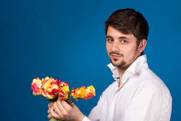 Man with bouquet of red roses