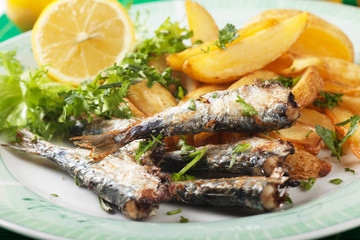 Grilled sardine fish with potato wedges