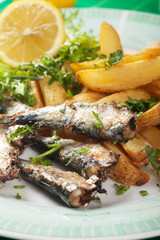 Grilled sardine fish with potato wedges