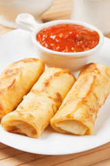 Egg rolls with tomato sauce