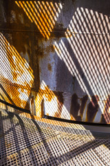 pattern of rusty chimney with reflection of son