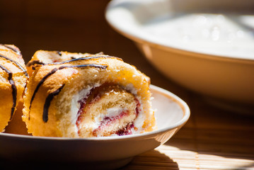 berry roll slices on plate and cereal