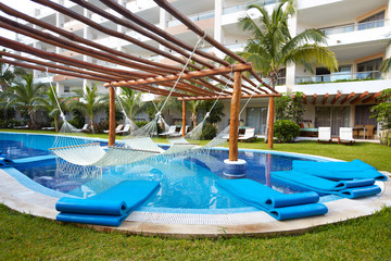 Swimming pool and hammock.