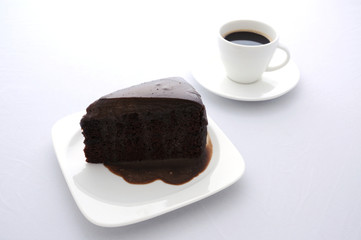 Piece of chocolate cake with coffee