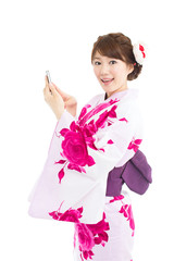 Beautiful young woman wearing japanese traditional kimono