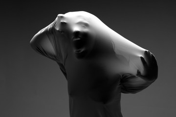 Scary Horror Image of a Woman Trapped in Fabric - 52932824