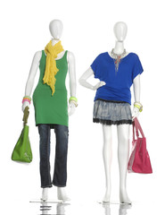 female clothing in jeans with scarf, bag on two mannequin