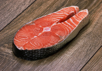 Piece of a salmon on a wood