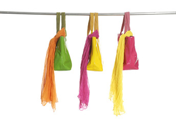 Three silk fabric of scarf and bag on a hanger