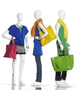 fashion dress with handbag and scarf on female three mannequin