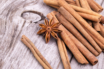 Different spices, Cinnamon, anise on wooden table