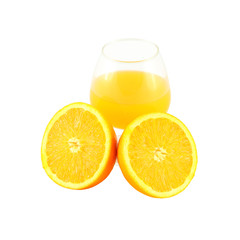 Orange juice in brandy glass and two half fruit