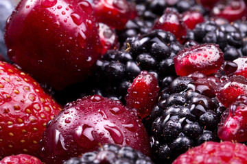 tasty summer fruits on a wooden table