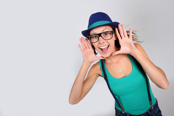 Stylish girl with suspenders showing big smile