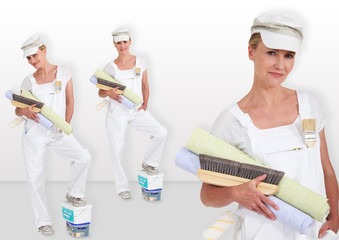 blonde lady carrying rolls of wall paper