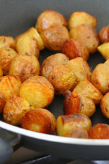 Baby potatoes on frying pan