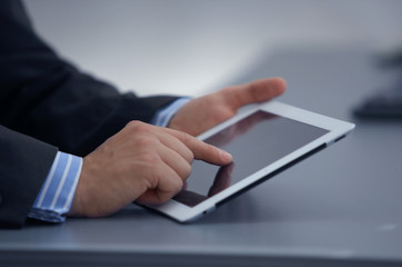 Businessman holding digital tablet
