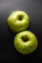 Two apples on water