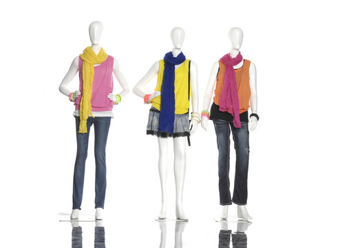 female dress with colorful scarf on three mannequin