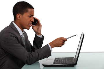 Unhappy businessman refuting a report