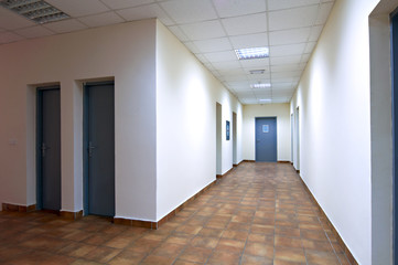Fototapeta na wymiar empty long corridor modern office building