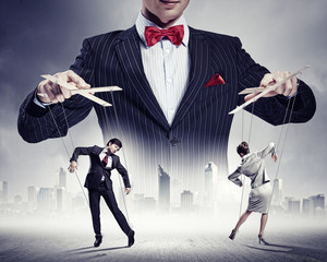 Businessman puppeteer