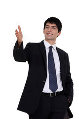 Happy businessman directing with hand