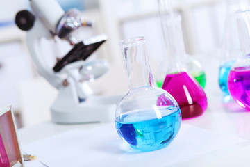 Chemistry laboratory glassware with colour liquids
