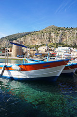 Fototapeta na wymiar Red fishing boats at Mondello, Sicily