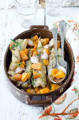 .Baked fish with pumpkin