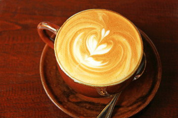 Cappuccino or latte coffee with heart shape